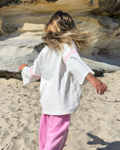 Stay Wild Ocean Child Tee, girls' oversized white graphic tee, back view