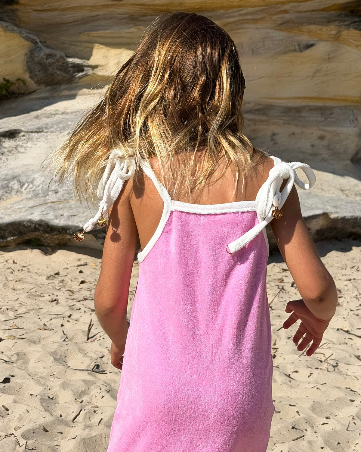 Terry Dress in Pink, girls' terry towelling tie-strap dress, back view